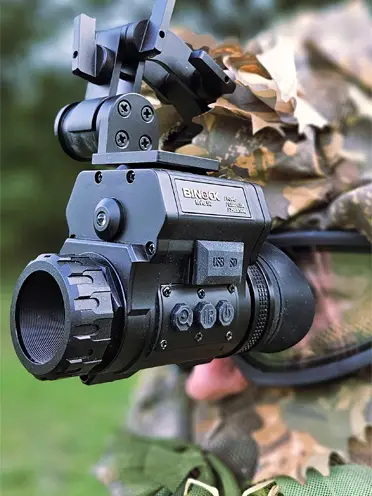 a man wearing binock night vision goggles model nvg50